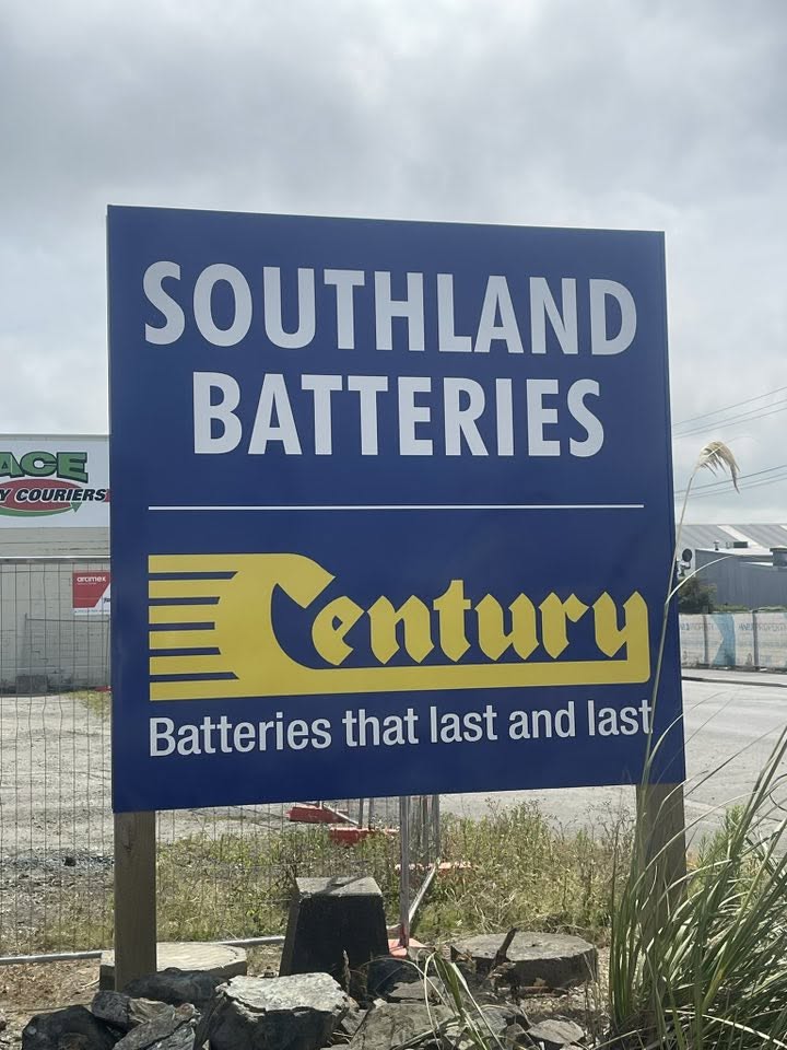 Southland Batteries and Century roadside sign in Invercargill